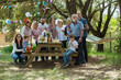 © CACTUS Creative Studio/Stocksy - Big family portrait in the garden