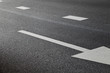 © Amsterdam/Stocksy - asphalt road with arrow