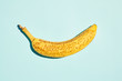 © Jeff Wasserman/Stocksy - Ripe banana on blue table