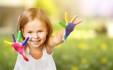 Wall Mural - Cute little girl with colorful painted hands