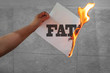 Burn fat text on burning paper