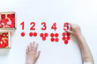 Montessori material. Children's hands. The study of mathematics