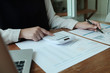 © Wanda - Business People Meeting Design Ideas  with pen analyzing financial documents professional investor working new start up project. Concept. business planning in office.
