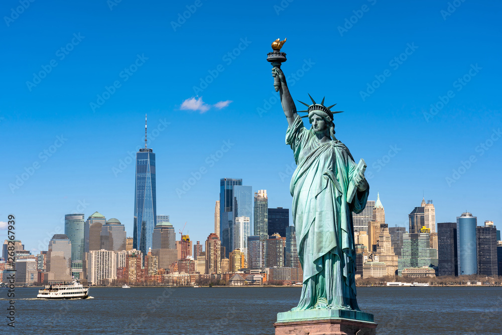 The Statue of Liberty over the Scene of New york cityscape river side which location is lower manhattan,Architecture and building with tourist concept - obrazy, fototapety, plakaty 