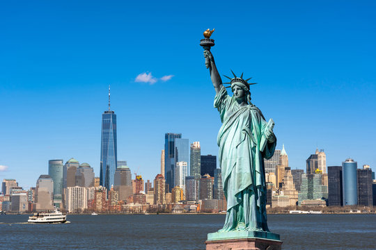 the statue of liberty over the scene of new york cityscape river side which location is lower manhat