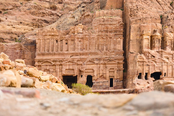 Wall Mural - (Selective focus) Stunning view of a huge temple carved in stone in the beautiful Petra site. Petra is a Unesco World heritage site, historical and archaeological city in southern Jordan.