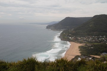 panorama view of a golden sandy beach between melbourne and sydney