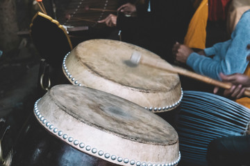 Wall Mural - man is playing snare drum in low light background.