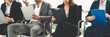 © InfiniteFlow - Businesswomen and businessmen holding resume CV folder while waiting on chairs in office for job interview. Corporate business and human resources concept.