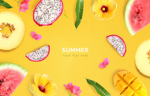 Creative Layout Made Of Melon, Watermelon, Dragon Fruit, Mango And Flowers On Yellow Background.  Tropical Flat Lay. Summer Fruits Concept. 