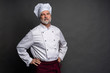 © opolja - Pleased mature chef looking confidently at the camera and laughing. Professional approach to business.