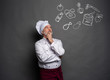 © opolja - Image of chef planing what to cook on gray background.Chef thinking.