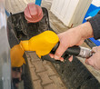 © schankz - Refueling a car with a pistol at a gas station