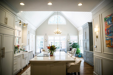 Wall Mural - Open Concept Elegant and Spacious Kitchen with Marble Countertops, Chandelier, and Two Toned Cabinets