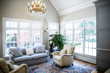 Wall Mural - Open Concept Living Room Den with Vaulted Ceilings and Lots of Windows with a Neutral color palette