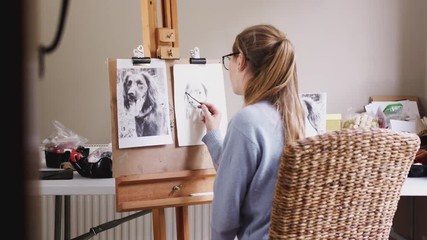 Wall Mural - View Through Door Of Female Teenage Artist At Easel Drawing Picture Of Dog In Charcoal