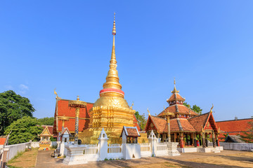 Golden pagoda and Buddha pavilion at Wat Pong Sanuk temple and museum in Lampang, North of Thailand