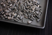 Sunflower Seeds In A Black Plate