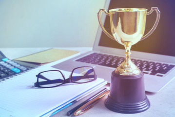 Wall Mural - trophy decorate on working table,acheive concept.