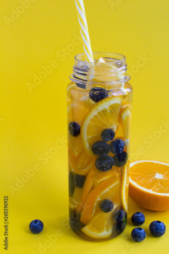 Download Infused Or Detox Water With Orange And Blueberry In The Bottle On The Yellow Background Copy Space Closeup Buy This Stock Photo And Explore Similar Images At Adobe Stock Adobe Stock PSD Mockup Templates