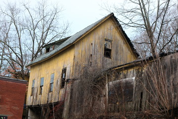 Wall Mural - Old abandoned and decayed wooden historic  barn 