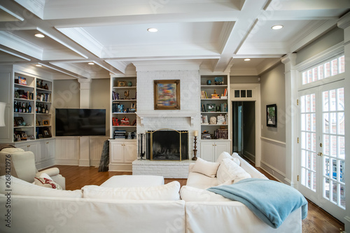 Large Living Room Den In Home With Vaulted Tray Ceiling And