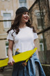 © Yakobchuk Olena - Happy hipster girl walking with yellow skateboard