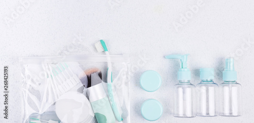 Photo  Plastic containers, toothbrush and makeup brush