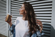 © Yakobchuk Olena - Pretty happy girl enjoy sunny weather and coffee