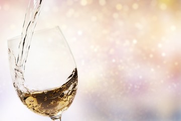 Sticker - White wine splash on abstract bokeh background