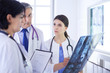 © lenets_tan - Group of doctors checking x-rays in a hospital