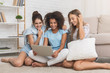 © Prostock-studio - Happy roommates using laptop, surfing internet at home