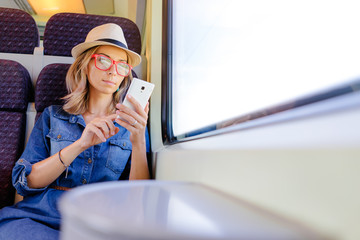 Wall Mural - Woman traveling by train.