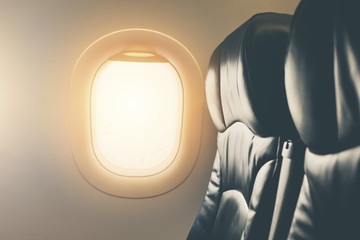 Wall Mural - empty seat airplane window view inside an aircraft close up for flight background