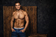 © blackday - Portrait of handsome muscular and sexy man wearing jeans