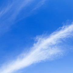 Poster - Bright white ripples clouds in light blue sky.