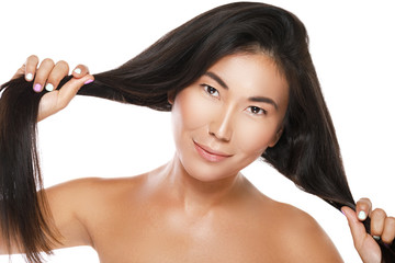 Asian woman with a healthy black hair