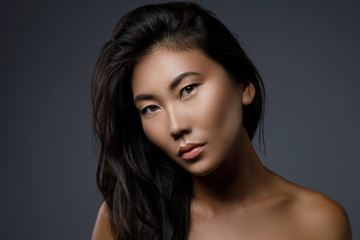 Wall Mural - beautiful asian woman with a black healthy hair