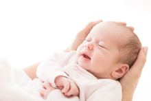 Newborn Baby Sleep On Mother Hands, New Born Girl Smiling And Sleeping, Happy Two Weeks Old Child On White