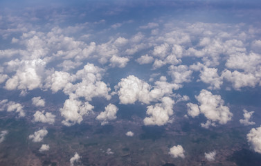 Wall Mural - view of the sky clouds above the clouds from airplane window