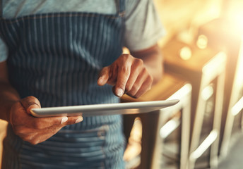 Poster - Cafe owner using digital tablet