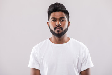 close up portrait of happy young indian man isolated on white background