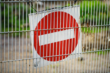 Wall Mural - Red and White British No Entry Road Sign with Steel Fence, Red Stop Road Sign, Traffic Sign Prohibiting, Fence Grilles Rust Texture Background, Warning Sign at Fence Wall, Prohibition Sign