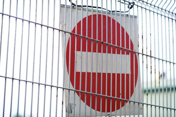 Wall Mural - Red and White British No Entry Road Sign with Steel Fence, Red Stop Road Sign, Traffic Sign Prohibiting, Fence Grilles Rust Texture Background, Warning Sign at Fence Wall, Prohibition Sign