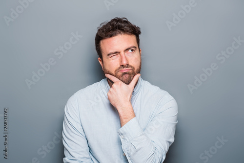 Cuadros en Lienzo One man portrait isolated on gray background
