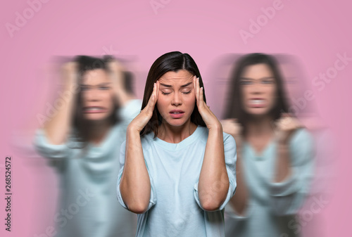 Fotomural Female suffering from low self esteem, anxiety, anger issues, inner critical voi
