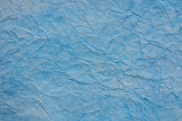 Wall Mural - blue creased pastel paper background texture