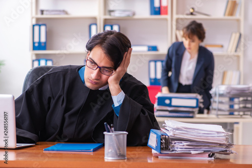 Two lawyers working in the office Tableau sur Toile