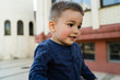 © Miljan Živković - Portrait of small boy in public by the building
