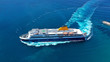 Aerial drone top view photo of high speed passenger ferry arriving at port of Mykonos island, Cyclades, Aegean sea, Greece